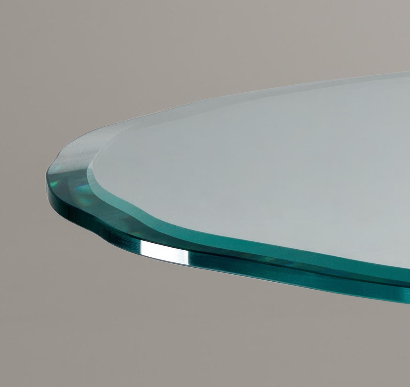 Ronde glazen eettafel met sculpturale poten
